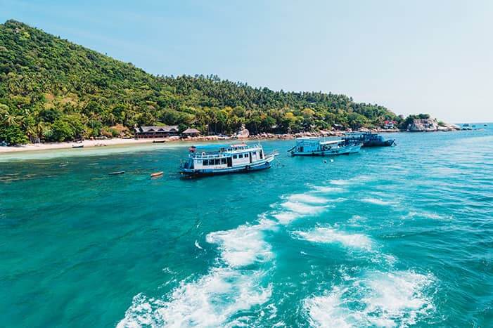 boats waiting for guests in koh tao beach